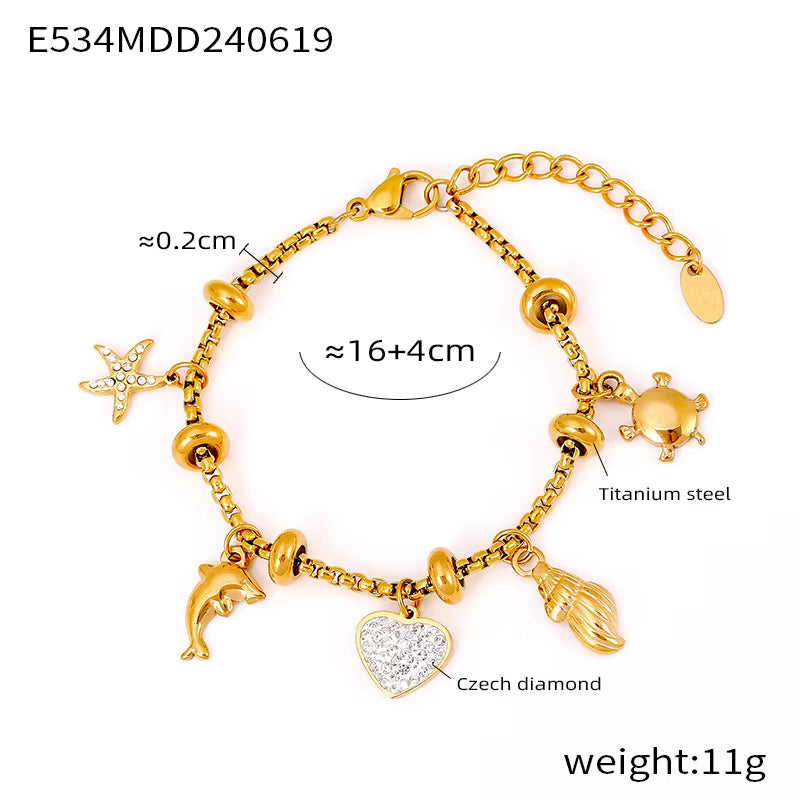 Bracelet Veloura in Dolphin Gold — stainless steel charm bracelet by Élan by AKI