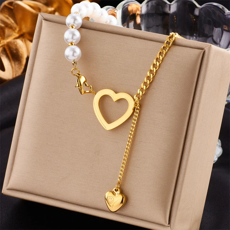 Celeste Necklace — faux pearl and hollow heart gold chain necklace by Élan by AKI