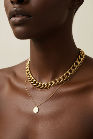 Dark skin – chunky gold chain necklace, collarbone close-up