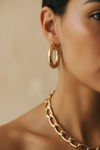 Light mixed skin – chunky gold hoops & chain necklace, ear/neck close-up